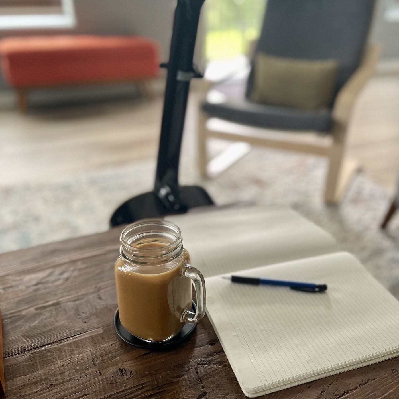 A songwriting notebook and coffee